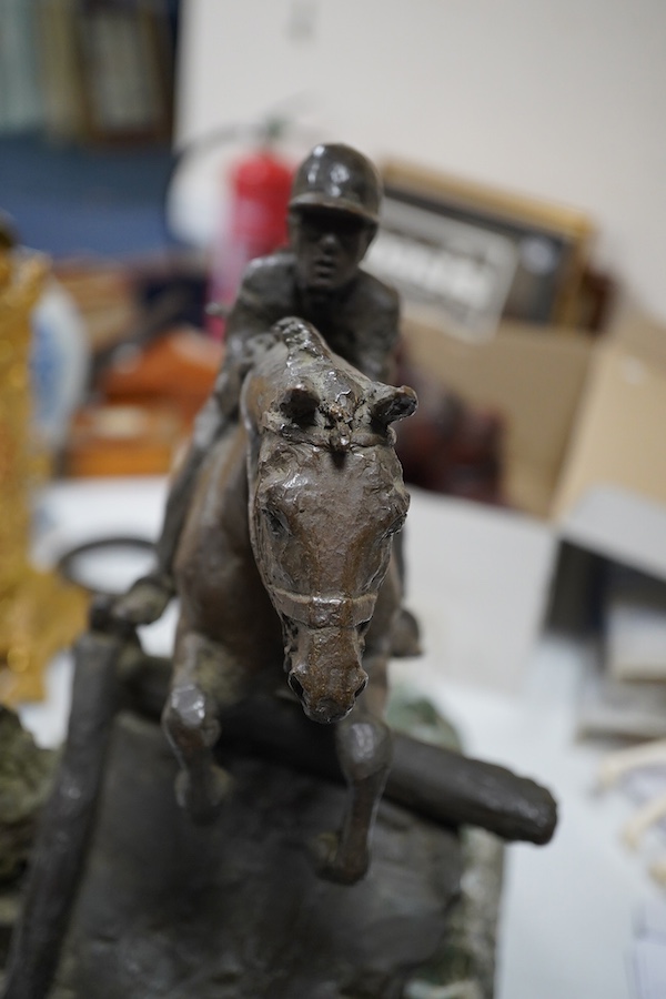 June Harrah (American), bronze group of a racehorse and rider, on a naturalistic green marble base, 30cm high, with paperwork including provenance and exhibition leaflet. Condition - good